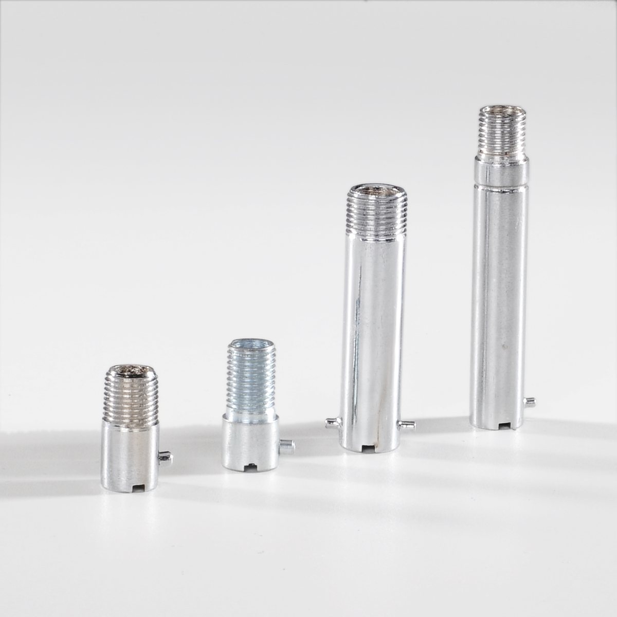 Four bayonet adaptors in stainless and plated finishes